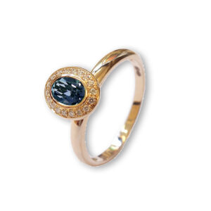 Rosé golden ring with London blue topaz and diamonds