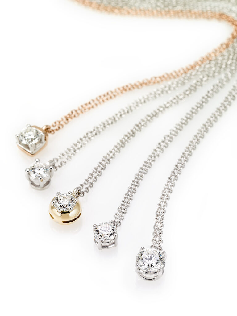 White-, yellow- and white gold with diamond