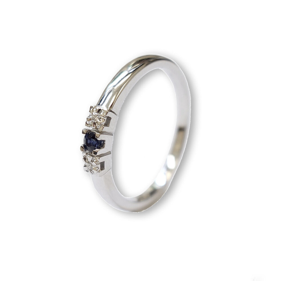 White golden ring with blue sapphire and diamonds