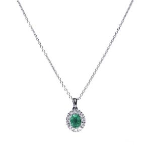 White gold, diamonds and emerald