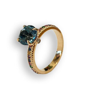 Rosé golden ring with rainbow gemstones and London Blue topaz