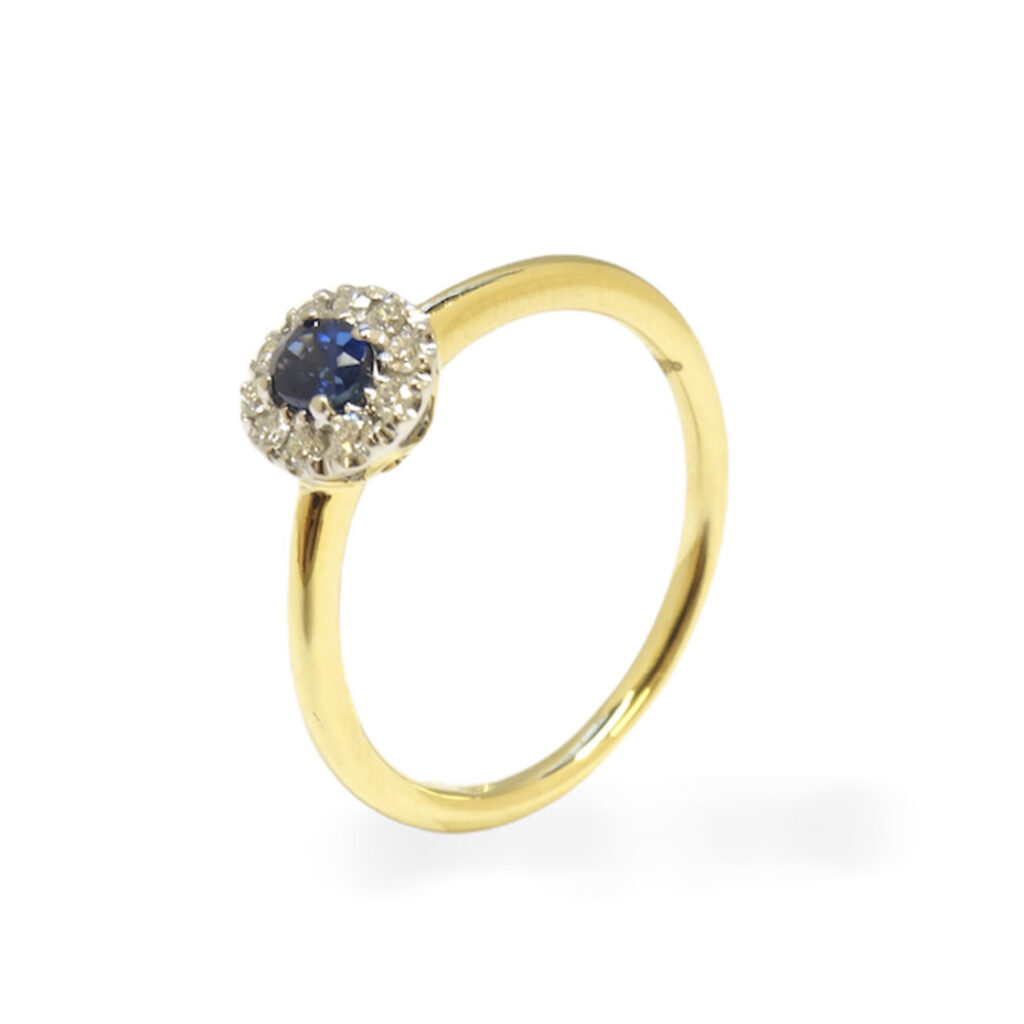 Yellow golden ring with blue sapphire and diamonds