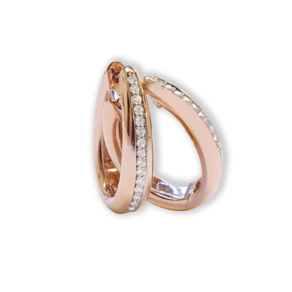 Drop shaped, rosé golden earrings with diamonds
