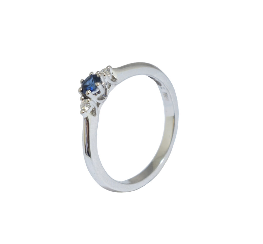 White golden ring with sapphire and diamonds
