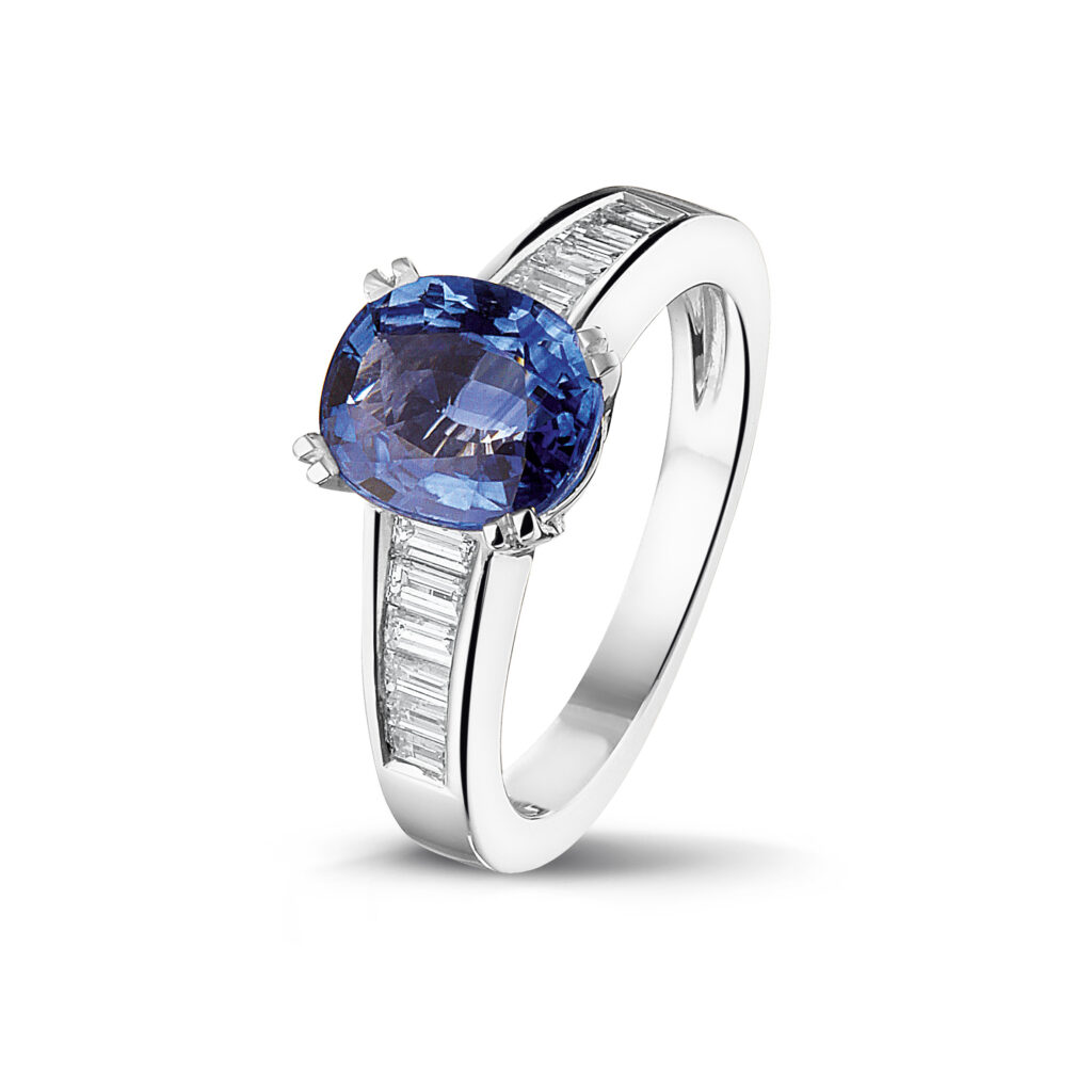 White golden ring with diamonds and blue sapphire