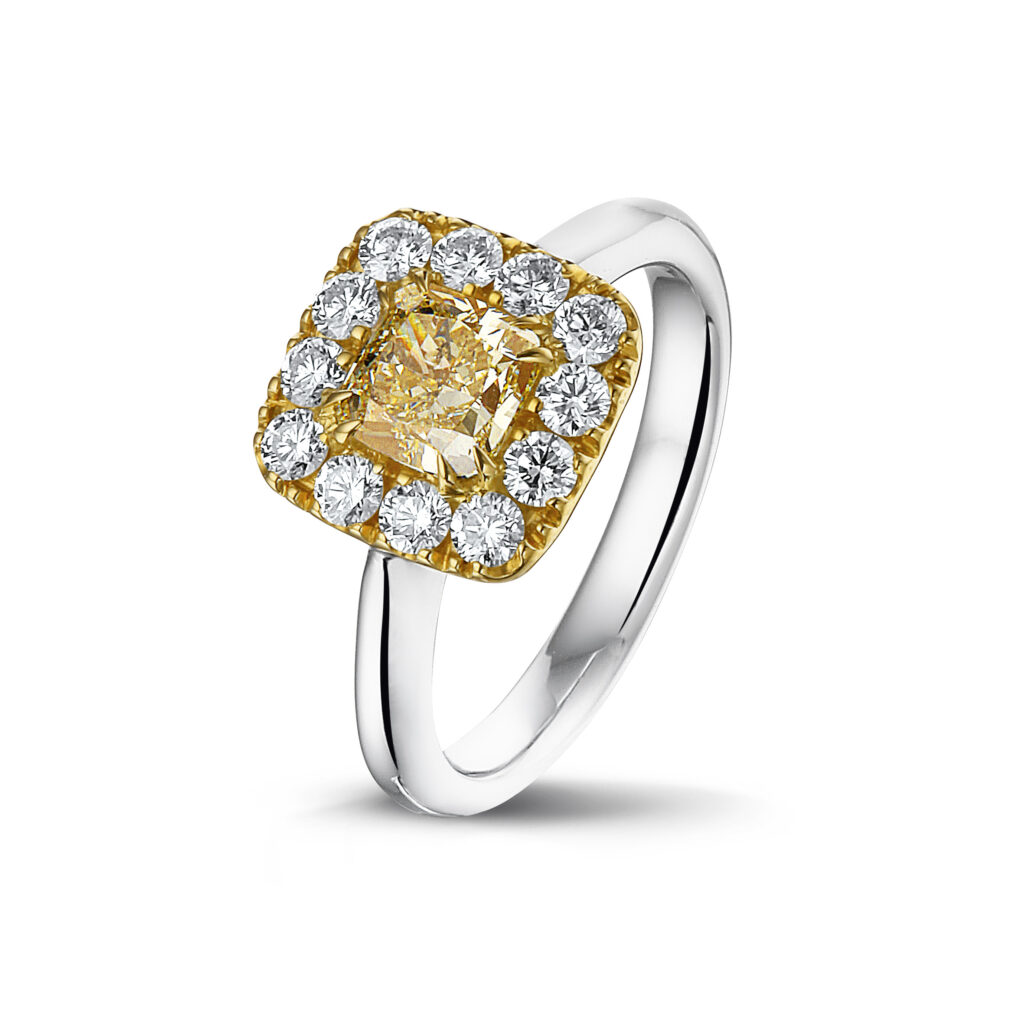 White golden ring with white diamonds and yellow diamond