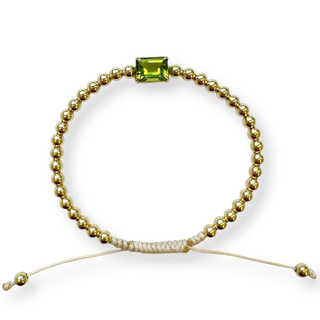 Yellow golden bracelet with peridot