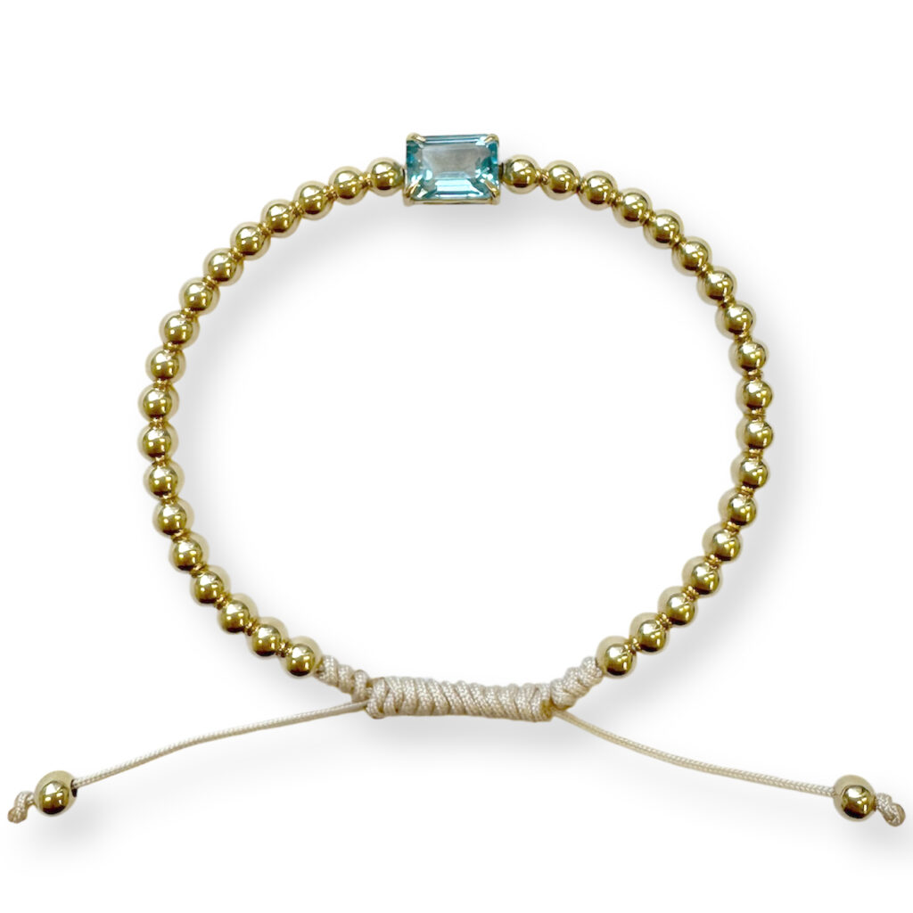 Yellow golden bracelet with topaz